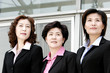 Photo: Three women in formal wear. Three women in formal wear.