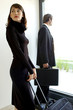 Photo: Man and woman with their bags. Man and woman with their bags.