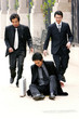 Two men running to their friend's aid. 