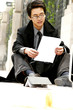 Man sitting on the floor reading after slipped. 