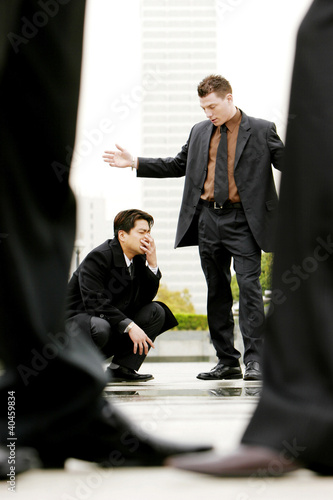 Photo: A man being scolded by his superior. A man being scolded by his superior.