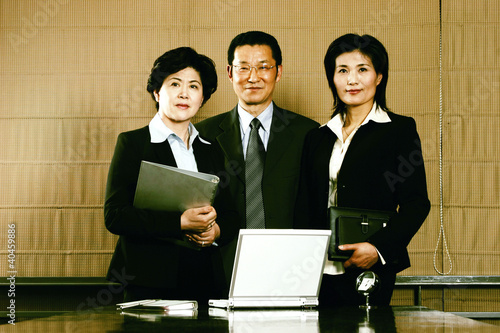 Photo: A manager and his assistants. A manager and his assistants.