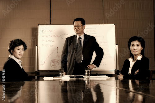 Photo: Business people in meeting room. Business people in meeting room.