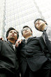Three men in office attires.
