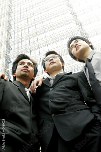 Photo: Three men in office attires. Three men in office attires.