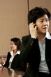 Business woman talking on the handphone. 