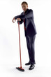 Businessman holding a broom. 