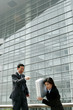 An angry man scolding his assistant. 