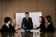 Business man and women clapping their hands after a good presentation. 