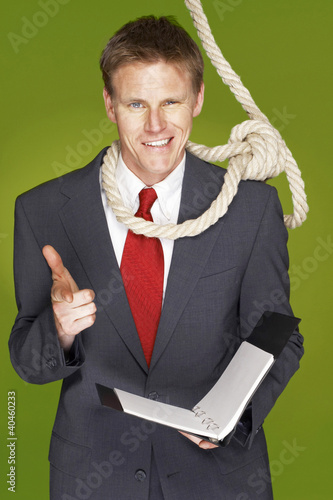 Photo: A man with rope hanging around his neck showing a hand gun. A man with rope hanging around his neck showing a hand gun.