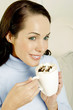 Woman holding a cup of mocha.