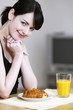 Woman having breakfast.