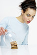 Woman covering up a stack of cookies.