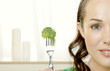 Woman picking up broccoli with a fork.