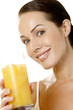 Woman holding a glass of orange juice.