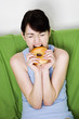 Woman biting on a doughnut.