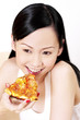 Woman eating pizza.