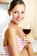 Woman holding a glass of wine.