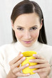 Woman holding a cup of coffee.