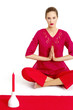 Woman in red practicing yoga.