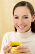 Woman holding a cup of coffee.