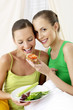 Woman feeding her friend.