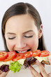 Woman eating a specially made croissant.