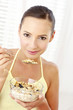 Woman having breakfast cereal.