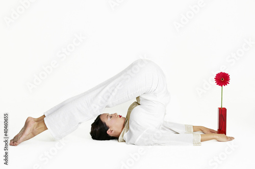 Photo: Woman practicing yoga. Woman practicing yoga.