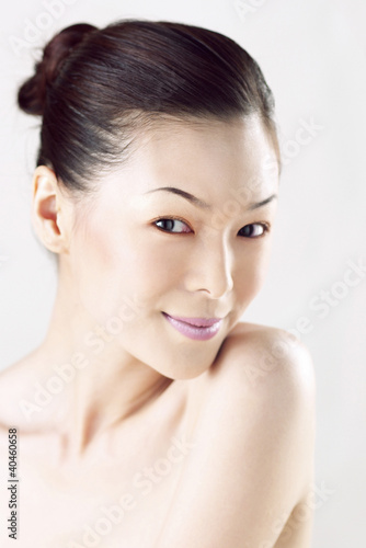 Photo: Woman flashing a smile at the camera. Woman flashing a smile at the camera.