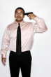 Businessman with cigarette pointing a gun at his head.