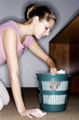 Businesswoman ransacking the dustbin.