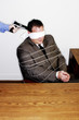 Businessman being robbed.