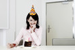 Woman celebrating her birthday alone.