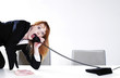 Photo: Businesswoman answering call in an uncomfortable way. Businesswoman answering call in an uncomfortable way.
