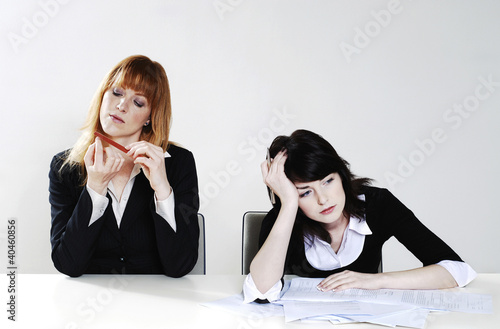 Photo: Businesswomen feeling lazy. Businesswomen feeling lazy.