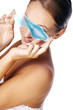 Woman covering her eyes with an eye gel.