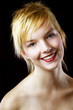 Photo: Woman flashing a smile at the camera. Woman flashing a smile at the camera.