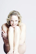 Foto: Naked woman sitting. Naked woman sitting.