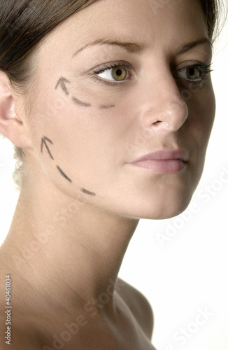 Photo: Woman's face with arrows showing up. Woman's face with arrows showing up.
