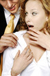Businesswoman shocked with her colleague's behavior.