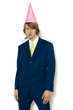 Photo: Businessman wearing party hat. Businessman wearing party hat.