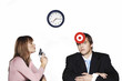 Photo: Businesswoman holding a pistol targeting at her subordinate. Businesswoman holding a pistol targeting at her subordinate.
