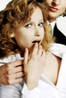 Businesswoman shocked with her colleague's behavior.