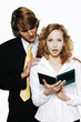 Businessman touching his female colleague.