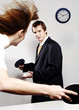 Businessman and businesswoman playing table tennis.