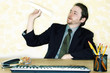 Businessman playing with a paper plane.