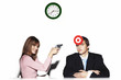 Photo: Businesswoman holding a pistol targeting at her subordinate. Businesswoman holding a pistol targeting at her subordinate.