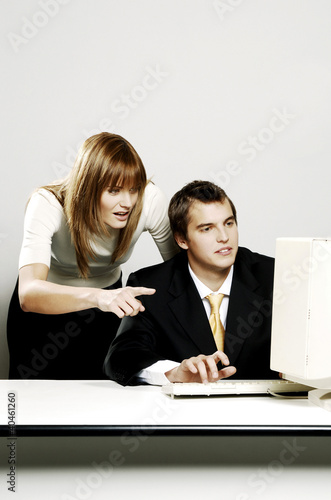 Photo: Businesswoman guiding her subordinate. Businesswoman guiding her subordinate.