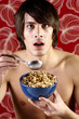 Man having cereal breakfast.